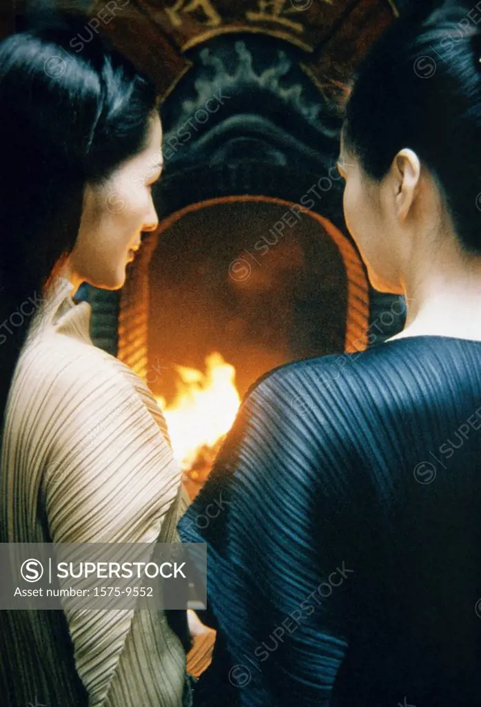 Two asian women _ over shoulder view