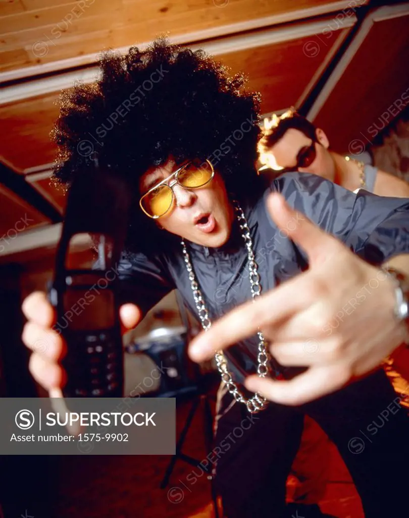 Young male with afro and celullar phone
