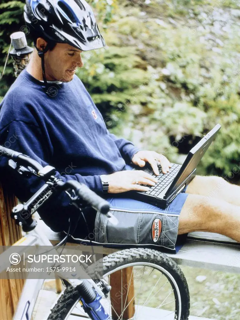 Moutain biker with laptop computer