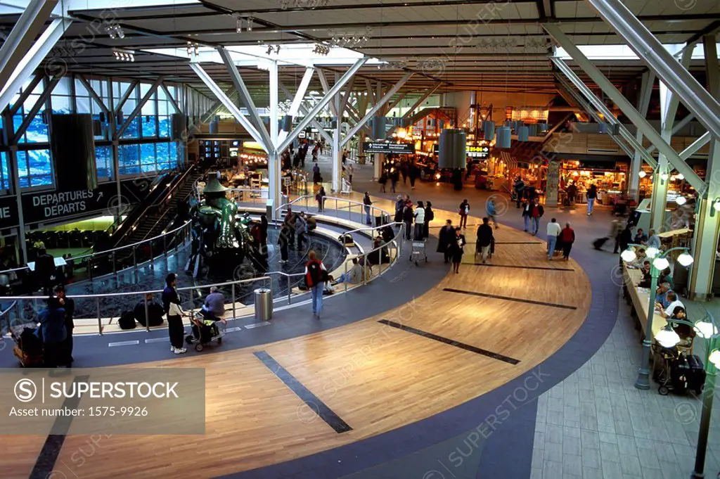 Interior of Vancouver International Airport, Departures, The Spirit Haida Gwaii sculpture in background, British Columbia, Canada