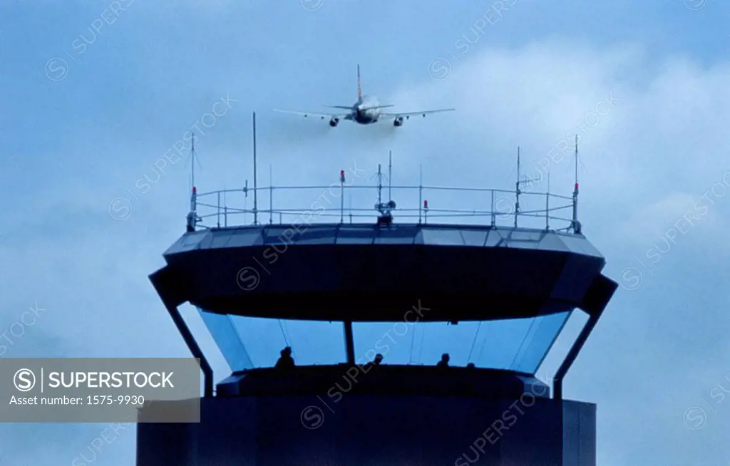 Airport control tower and jet airliner