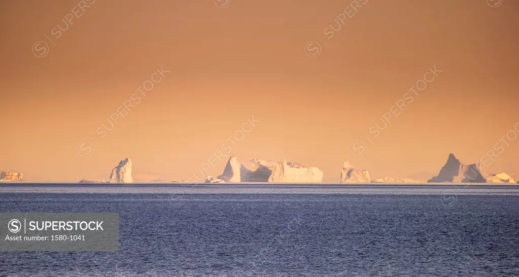 Icebergs floating in the sea, Scoresbysund, Greenland