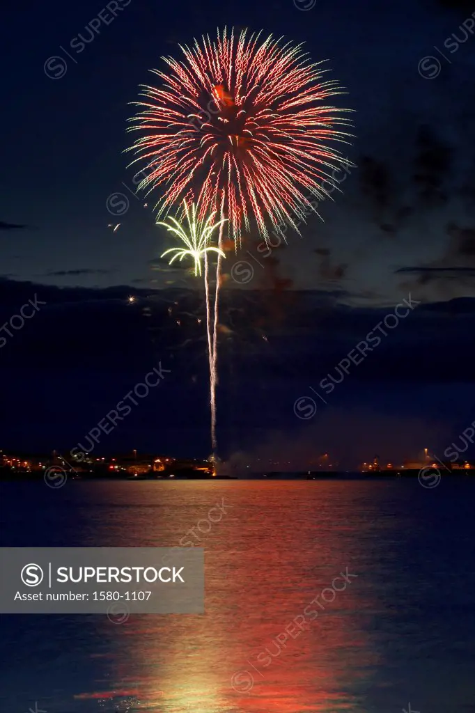 Fireworks display over the ocean, Reykjavik, Iceland
