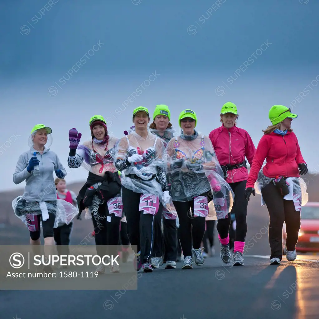 Women unite in the fight against breast cancer during a fundraiser, Moon Walk, Lake Myvatn, Iceland