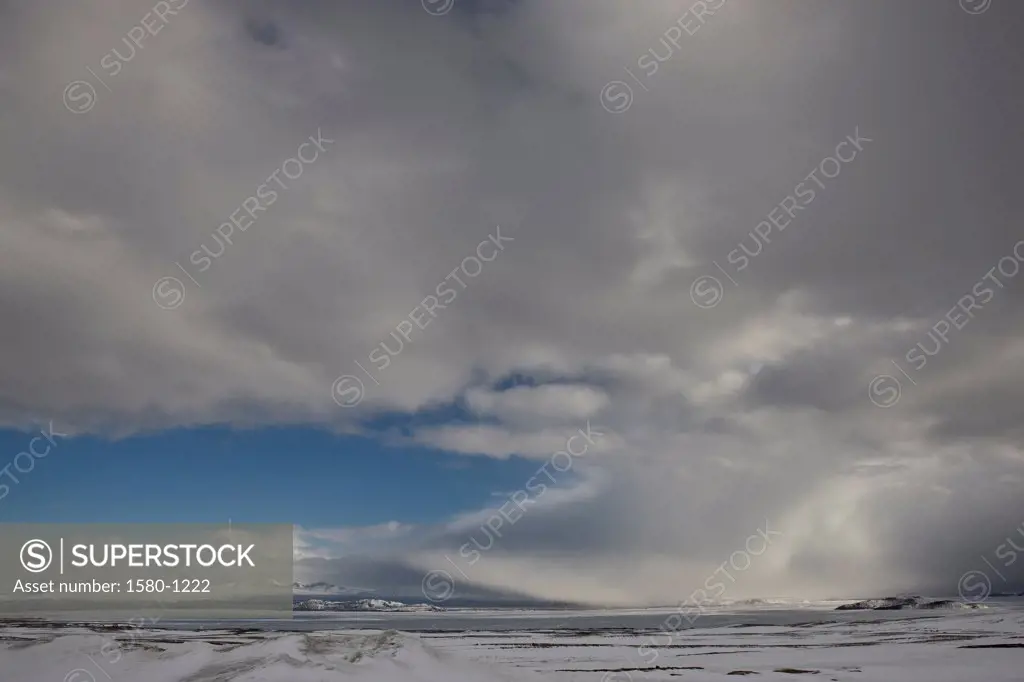 Clouds over a frozen lake in winter, Lake Thingvellir, Iceland
