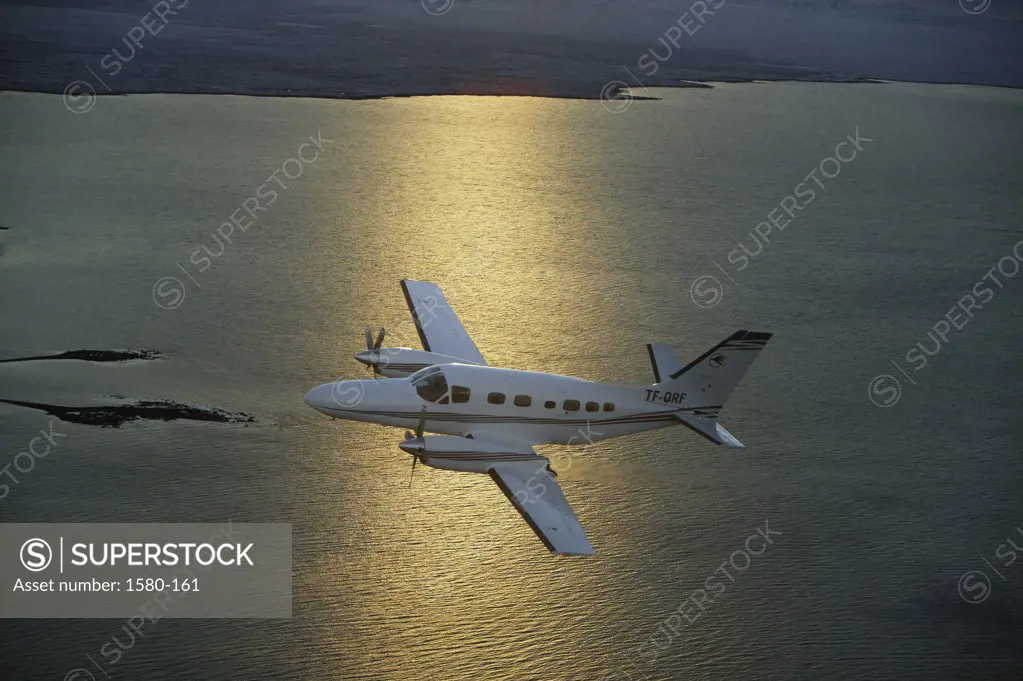 High angle view of a private airplane in flight over the sea, Cessna, Iceland