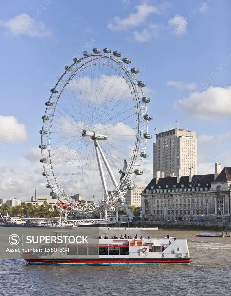 UK, England, London, Afternoon boat ride on River Thames, with London Eye in background