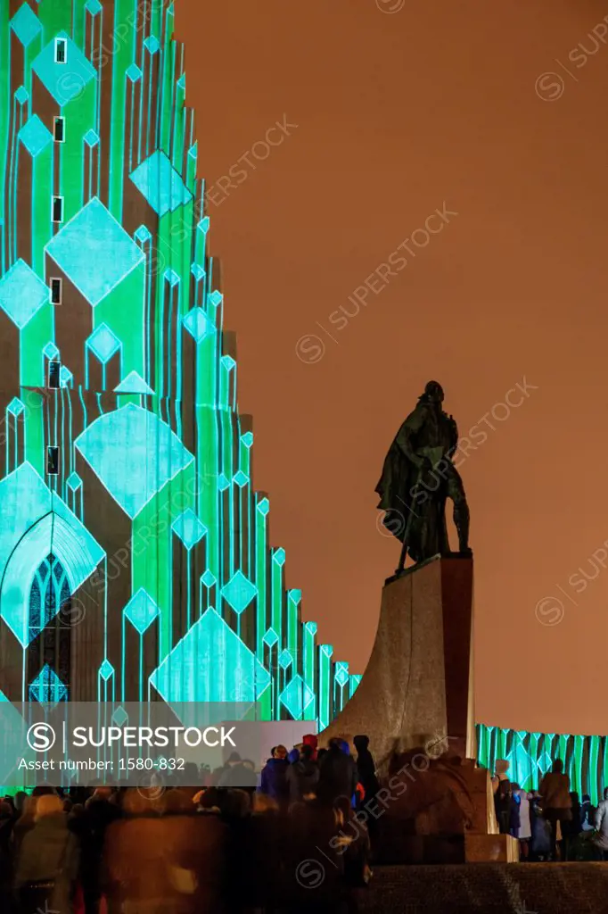 Iceland, Reykjavik, Hallgrimskirkja Church, Laser light show with statue of explorer Leif Eriksson, annual winter lights festival