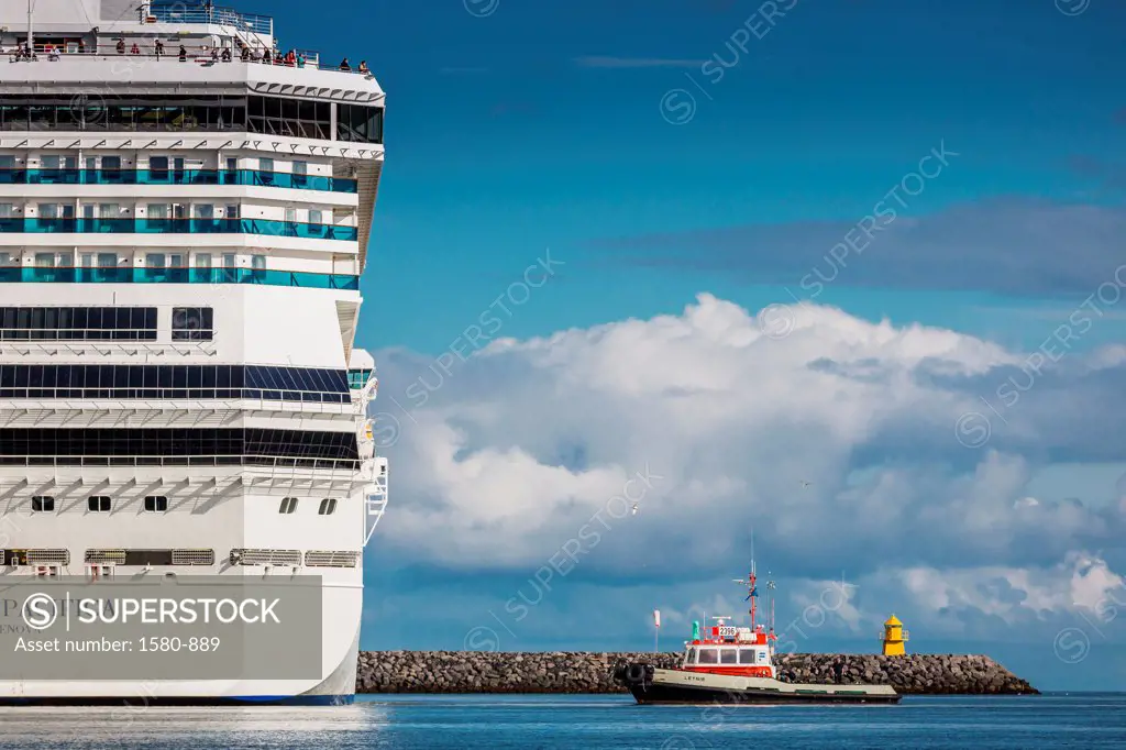 Iceland, Reykjavik, Large cruise ship with tugboat