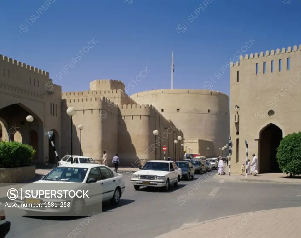Cars near an archway, Nizwa, Oman