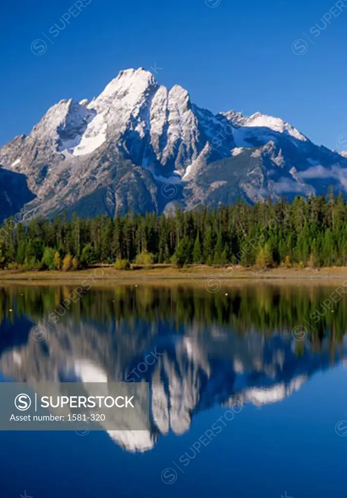 Reflection of a mountain in water, Grand Teton National Park, Wyoming, USA