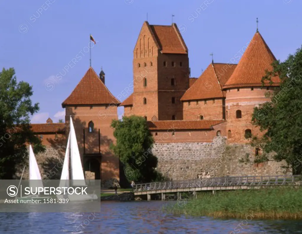 Sailboats in a lake in front of a castle, Trakai Castle, Trakai, Lithuania