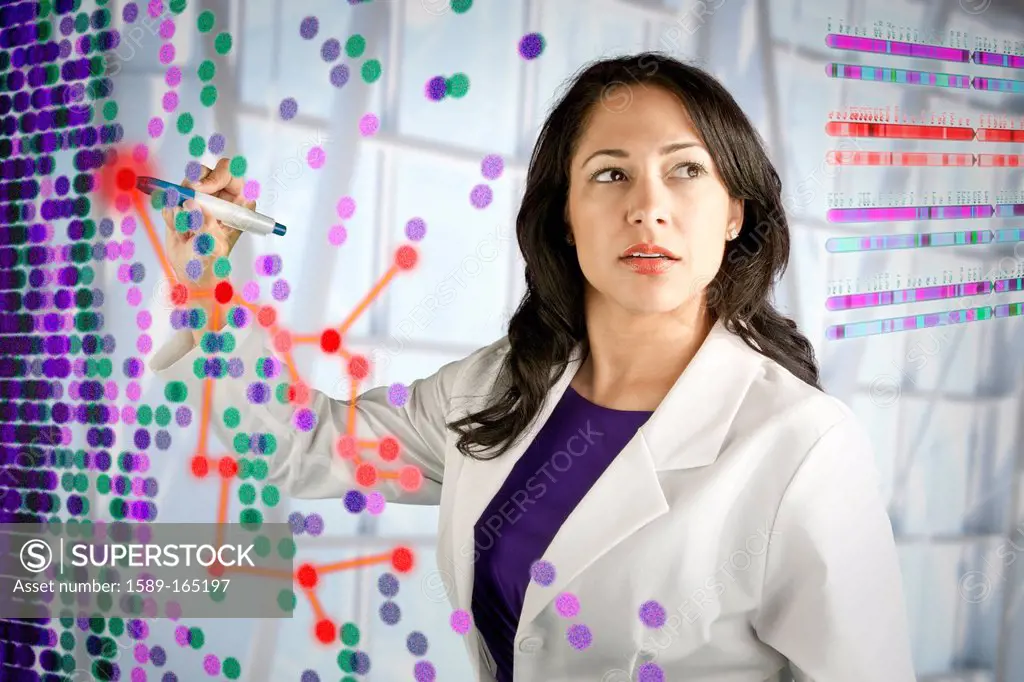 Mixed race scientist working with scientific images