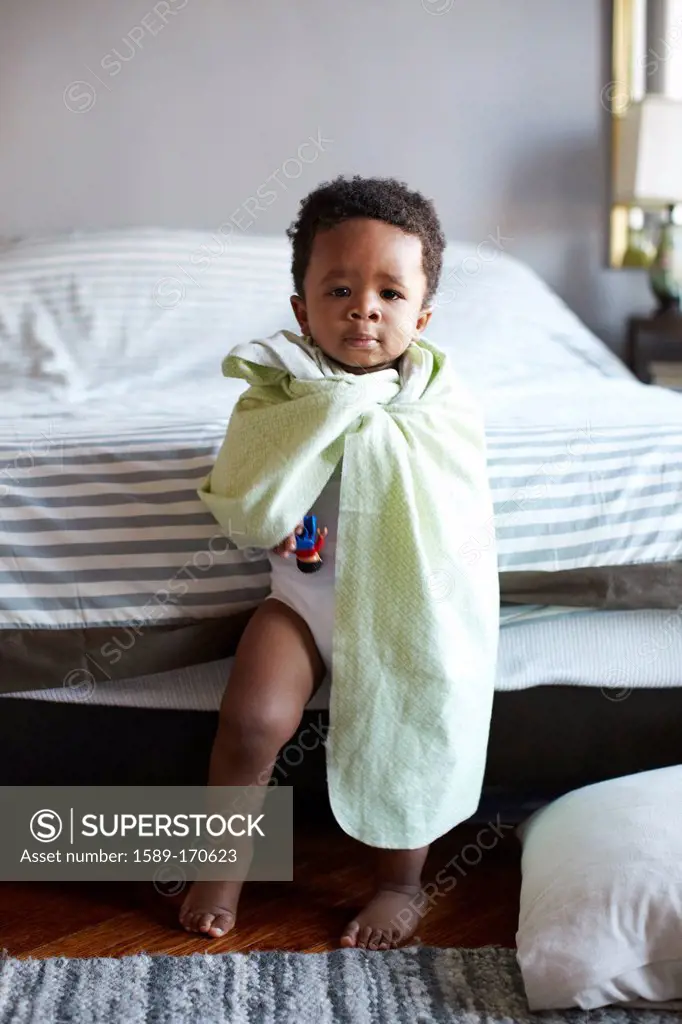 African American boy wrapped in blanket