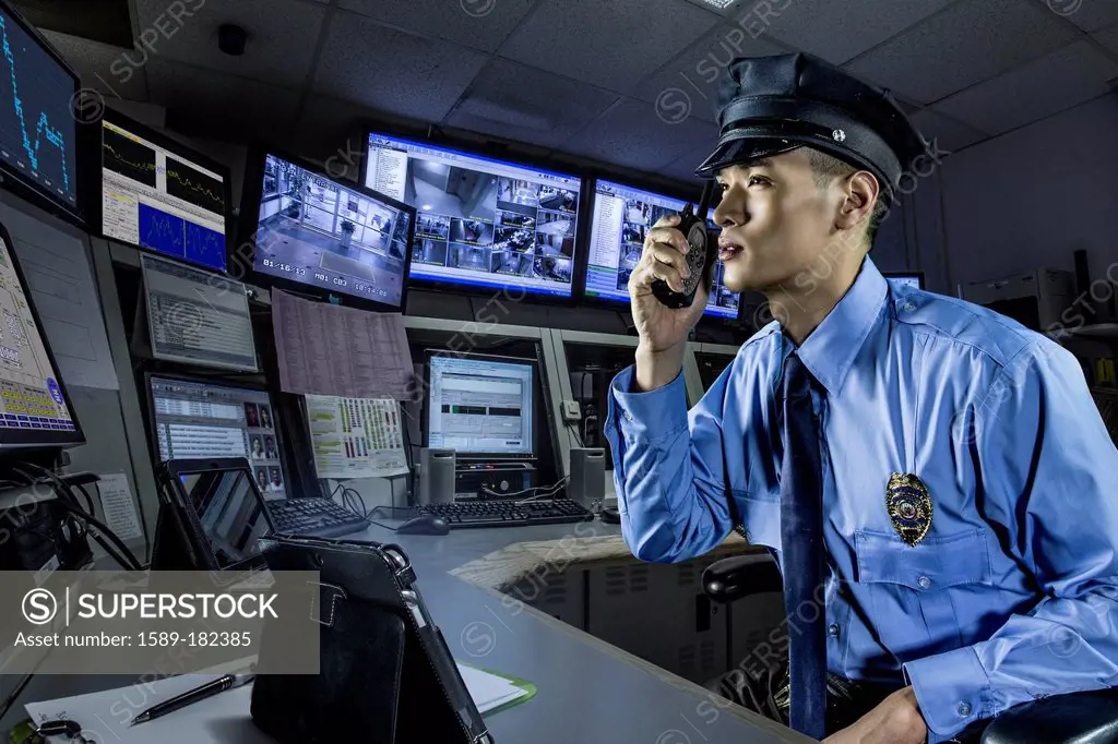 Chinese police officer working in control room