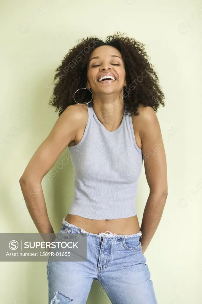 Woman standing and laughing