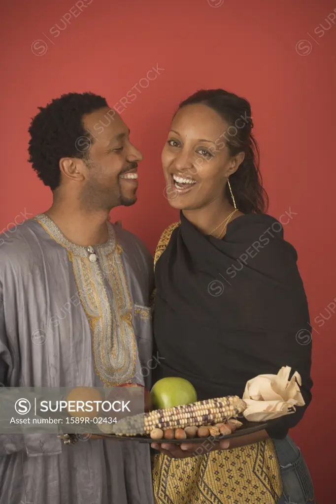 Mid adult couple celebrating Kwanzaa