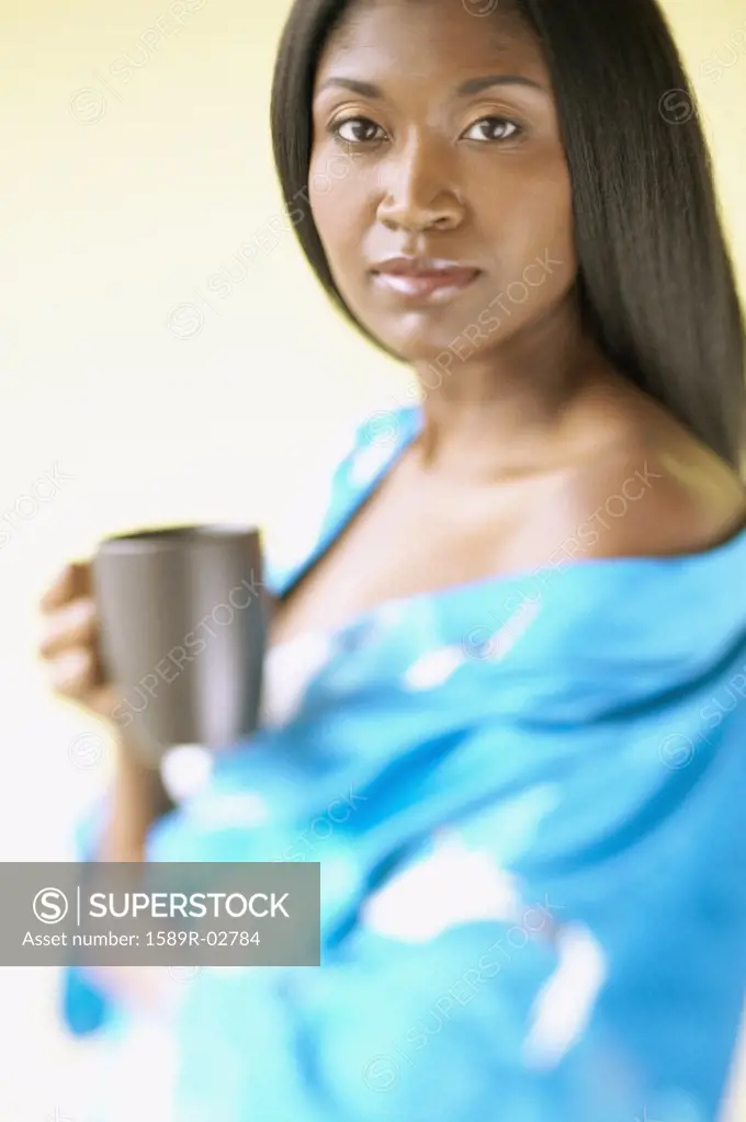 Portrait of a mid adult woman holding a mug