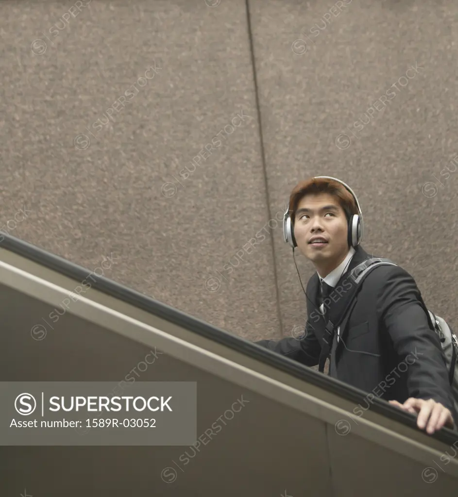 Young man walking up a staircase