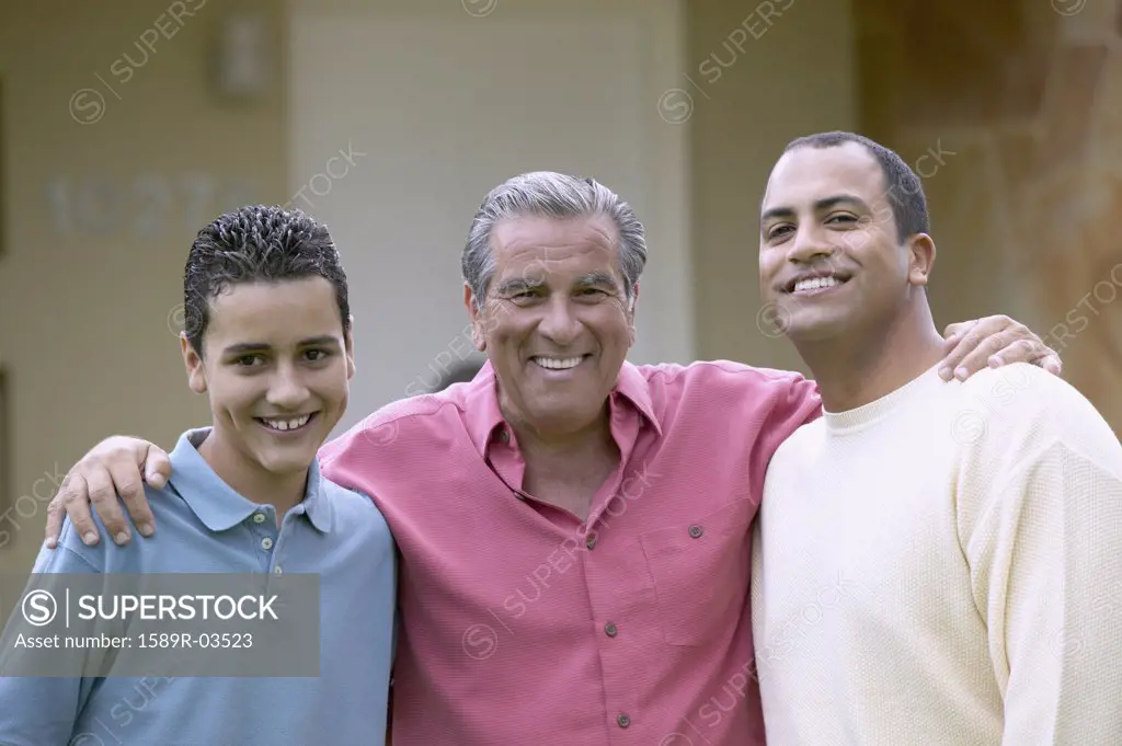 Portrait of a senior man standing with his son and grandson