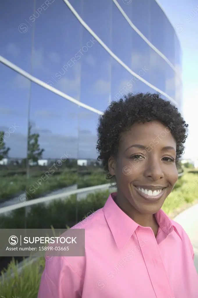 Portrait of a young woman standing and smiling