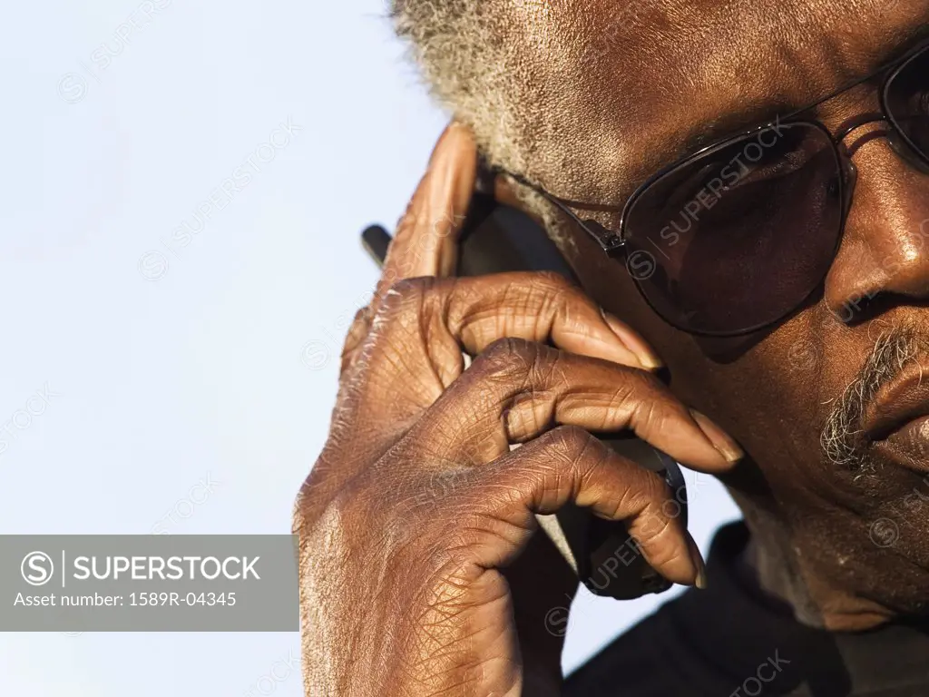 Portrait of an elderly man talking on a mobile phone