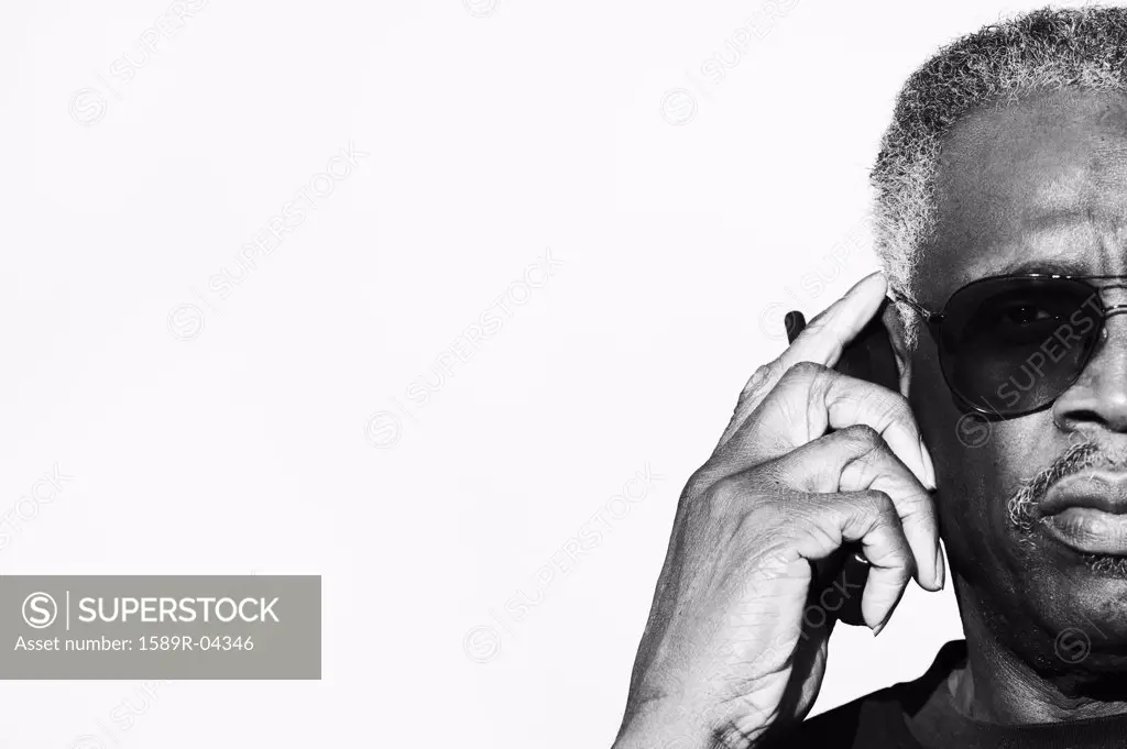 Portrait of an elderly man talking on a mobile phone