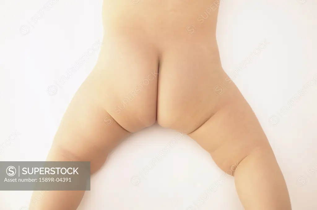 Rear view of naked baby's (6-9 months) bottom