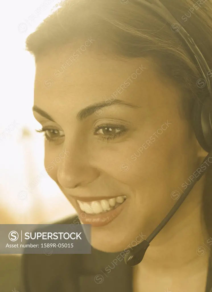 Young woman wearing a headset smiling