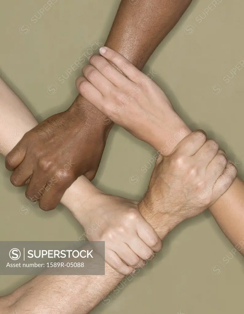 Four human hands holding a wrist in sequence