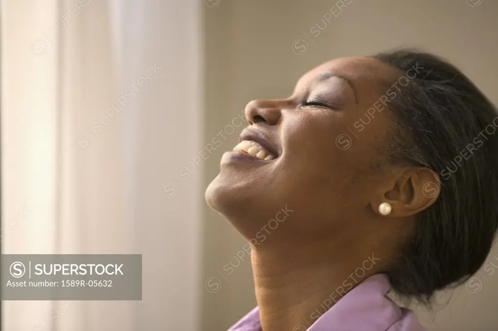 Side profile of a businesswoman laughing