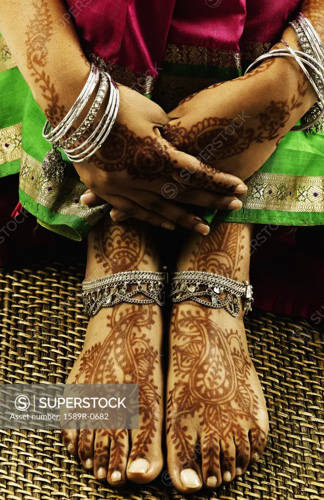 Closeup of decorated feet of a young woman