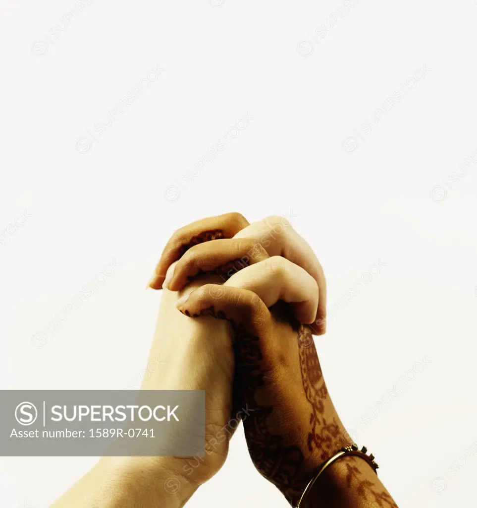 Human hands clasped together