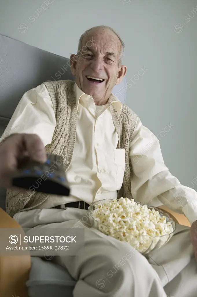 Senior man operating a remote control