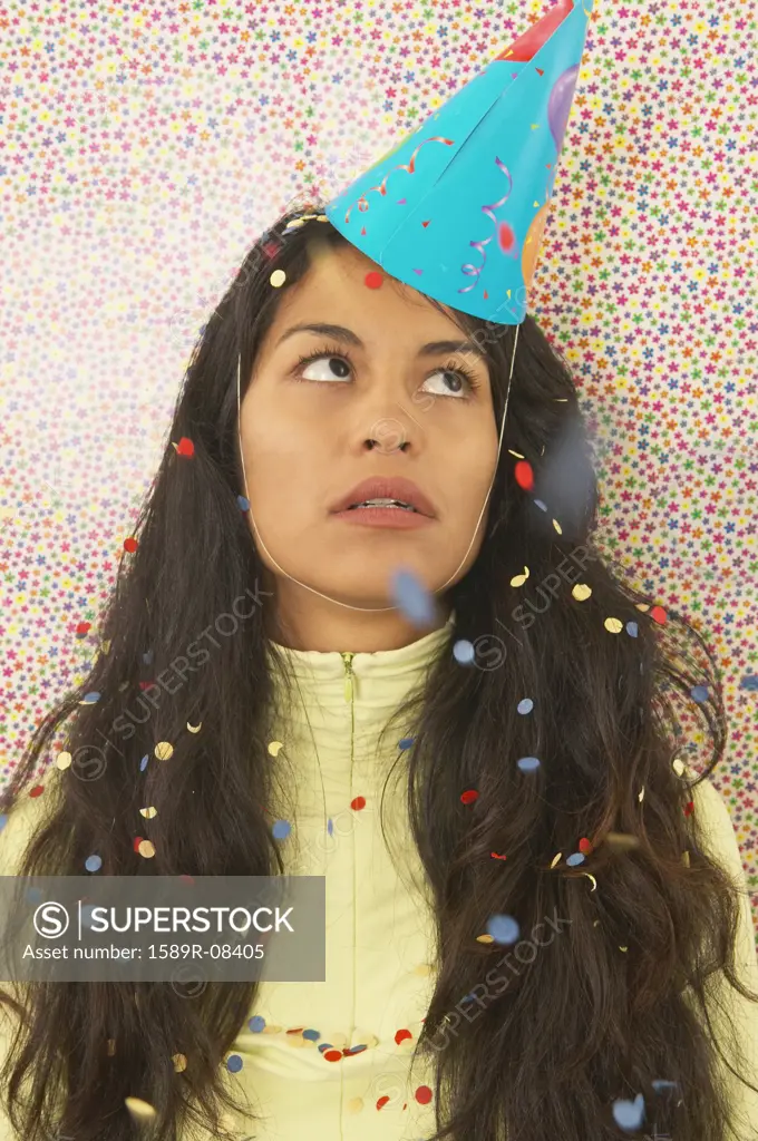 Young woman wearing a party hat