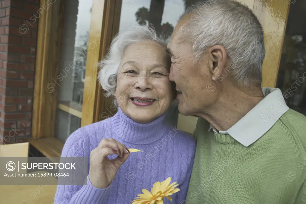 Senior man kissing a senior woman