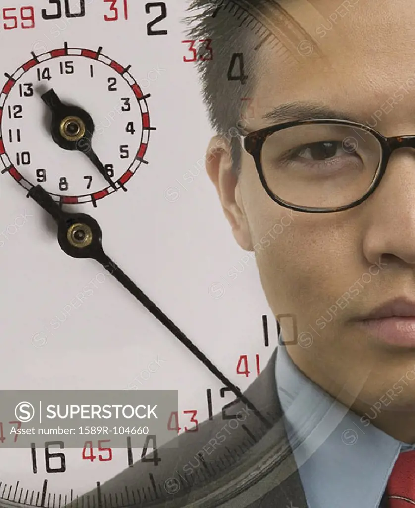 Young businessman with superimposed stopwatch image