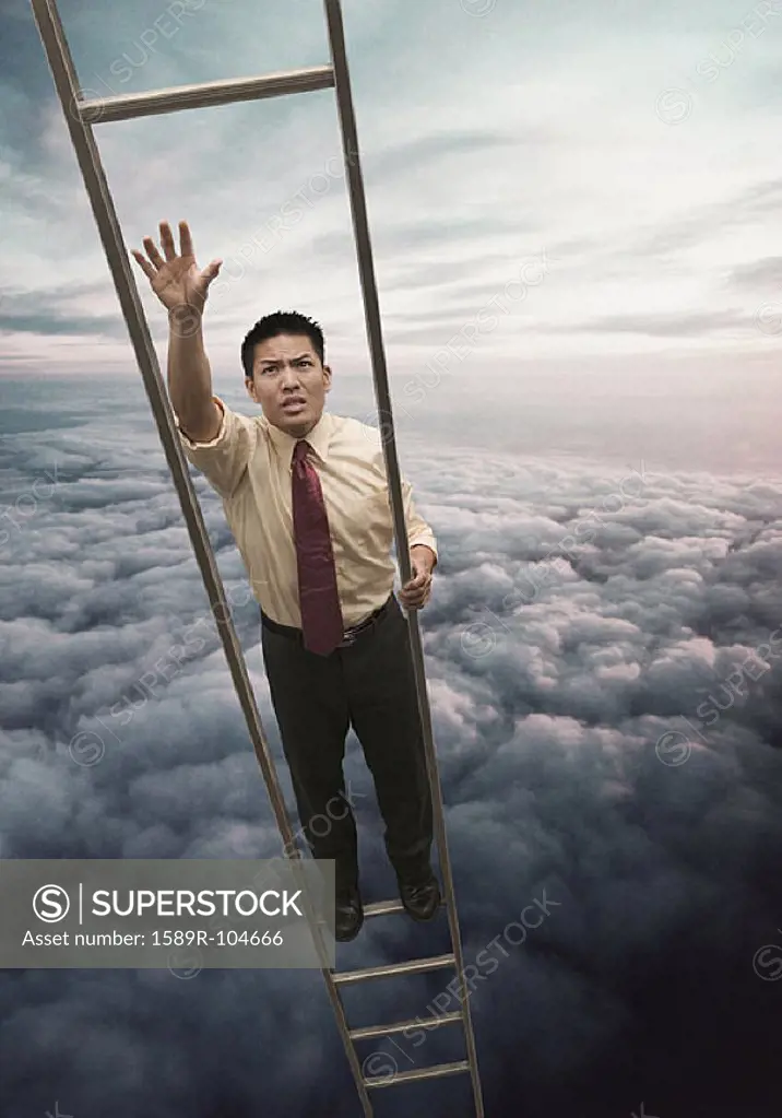 Young businessman unable to reach next rung on ladder in the clouds