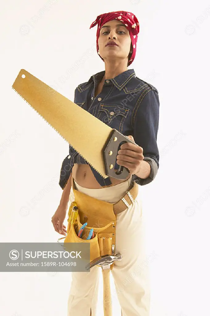 Young woman with construction tools