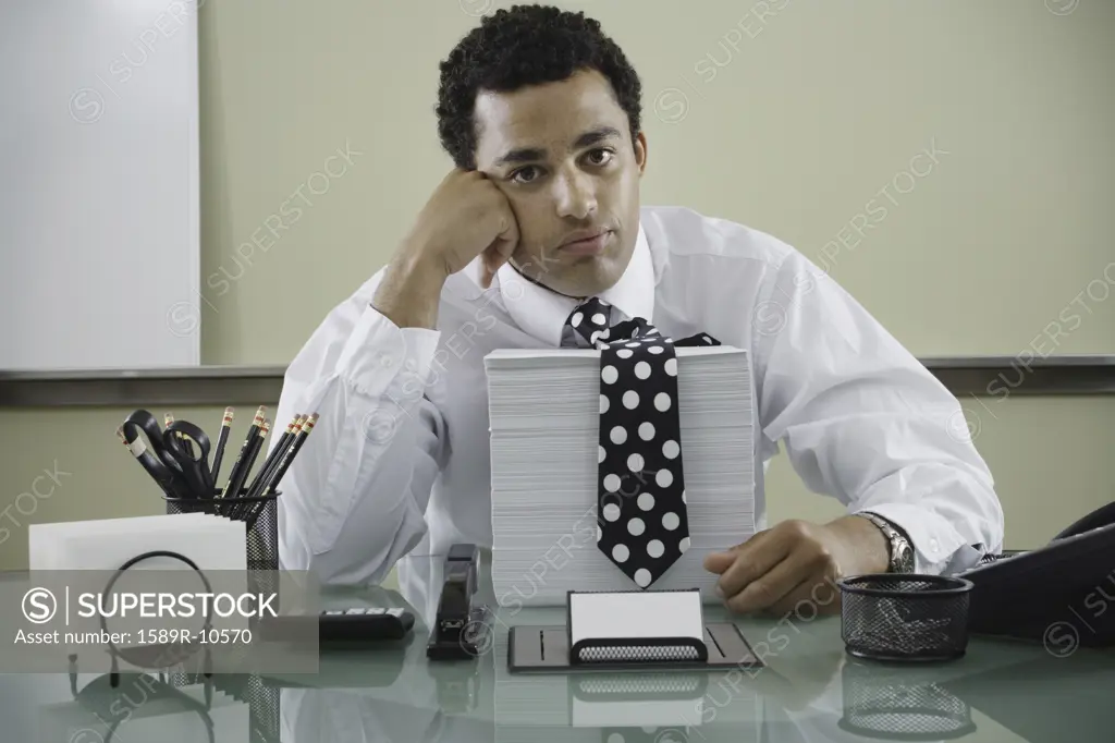 Office worker with stack of papers