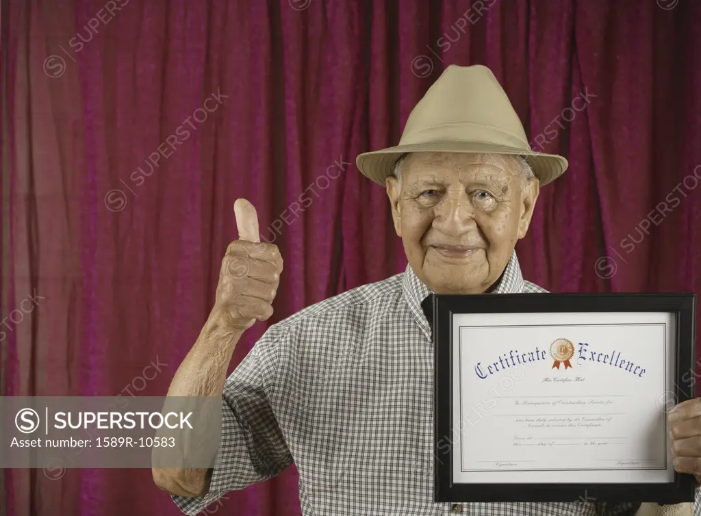 Smiling man holding certificate