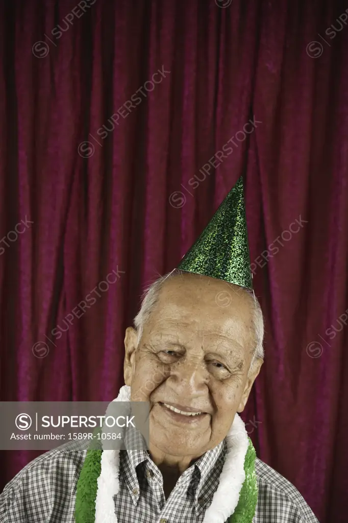 Smiling man in party hat