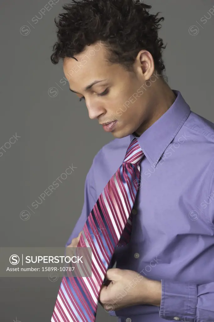 Young man wearing striped tie
