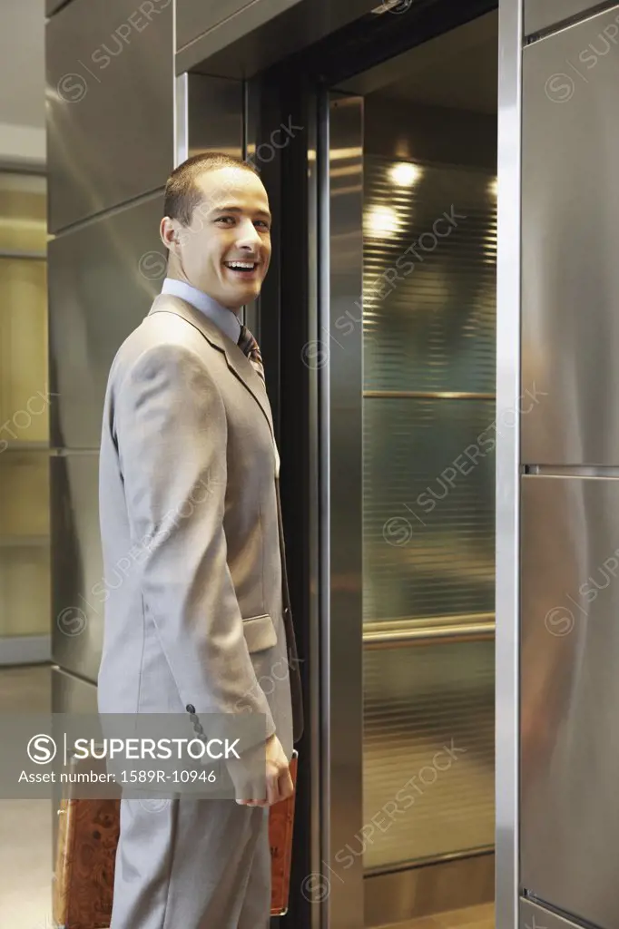 Businessman about to enter elevator