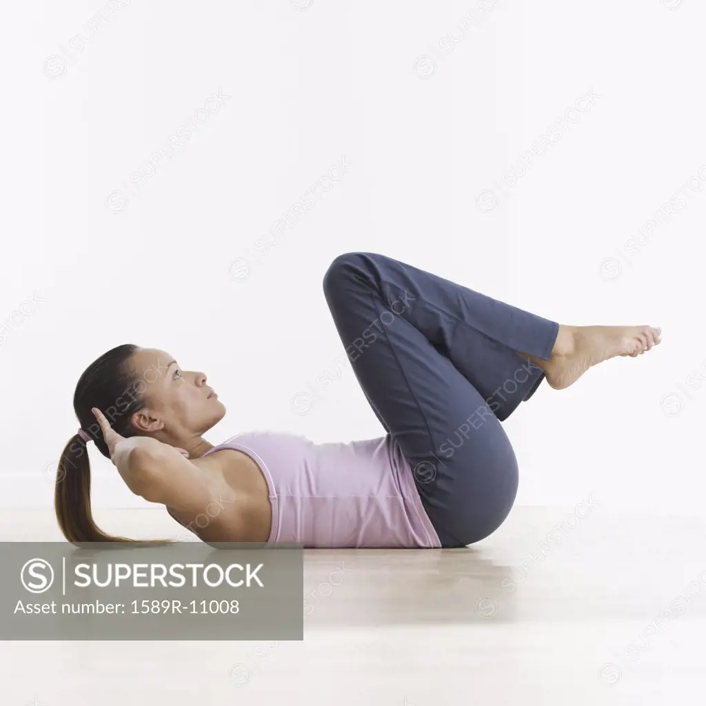 Side view of woman doing crunches