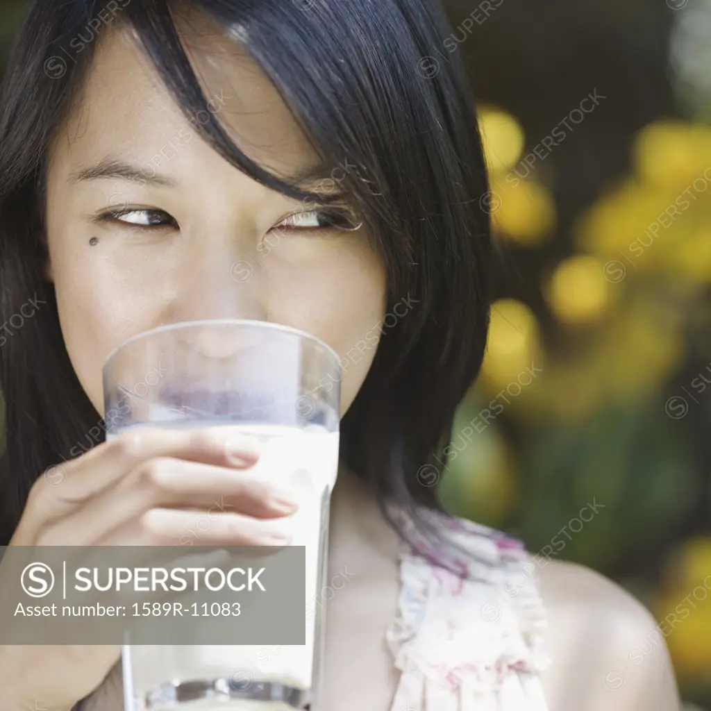 Woman drinking glass of milk
