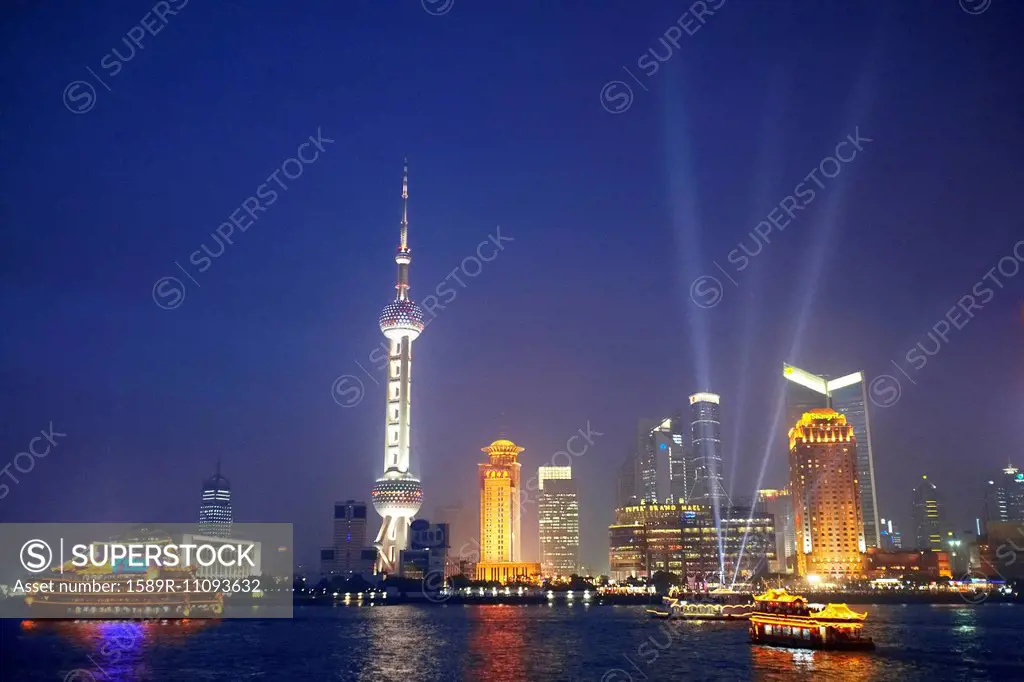 Shanghai city skyline lit up at night, Shanghai, China