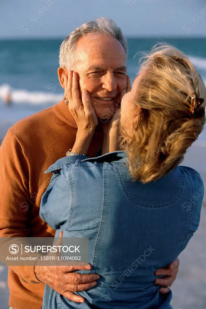 Senior couple hugging on beach