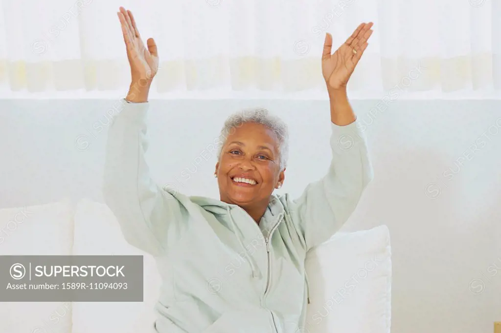 Senior woman clapping her hands