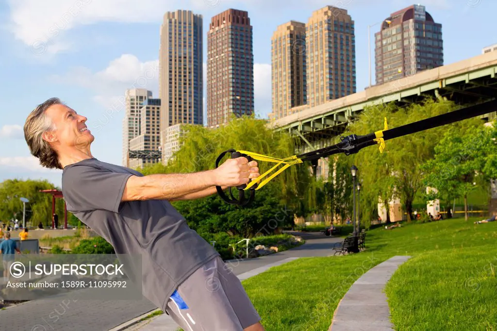 Caucasian man exercising in urban park